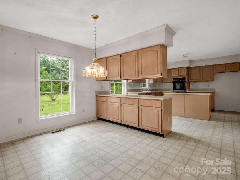 2000 Golf Course Road, Columbus, NC 28722.  MLS# CAR4268144, YatesRealty ID 18782. Breakfast area.