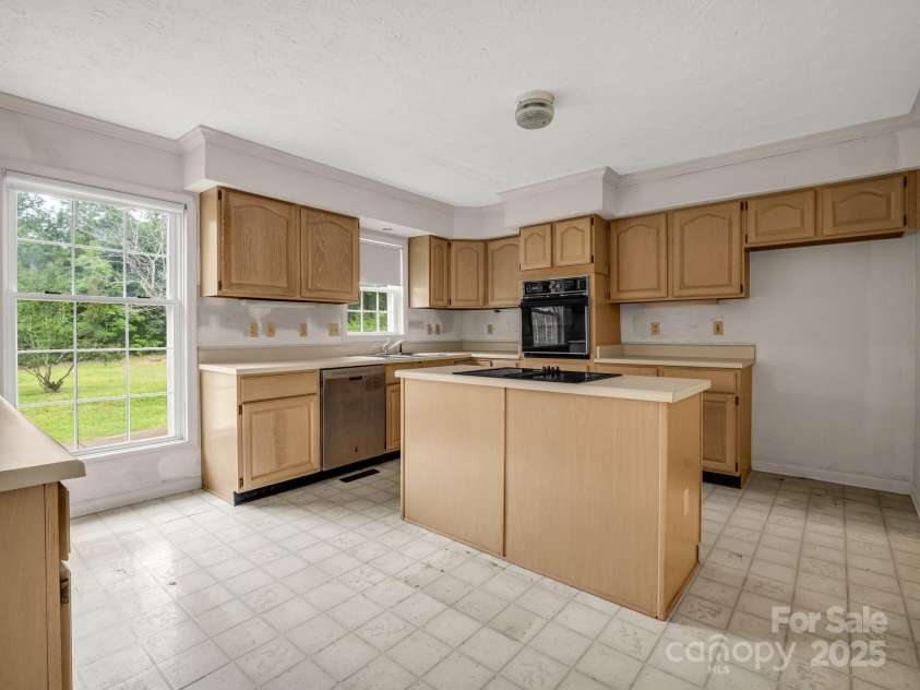 2000 Golf Course Road, Columbus, NC 28722.  MLS# CAR4268144, YatesRealty ID 18782. Lots of cabinet space in light and bright kitchen