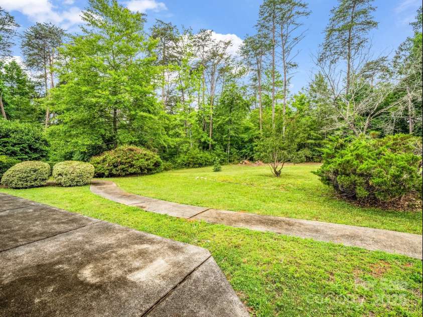 2000 Golf Course Road, Columbus, NC 28722.  MLS# CAR4268144, YatesRealty ID 18782. Portion of back yard from patio.