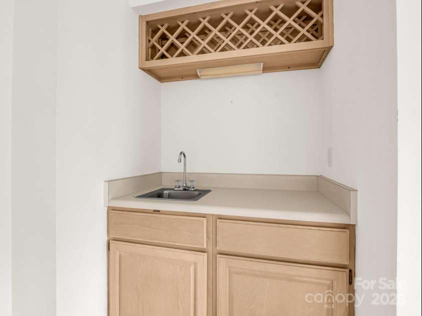 2000 Golf Course Road, Columbus, NC 28722.  MLS# CAR4268144, YatesRealty ID 18782. Wet bar in den.