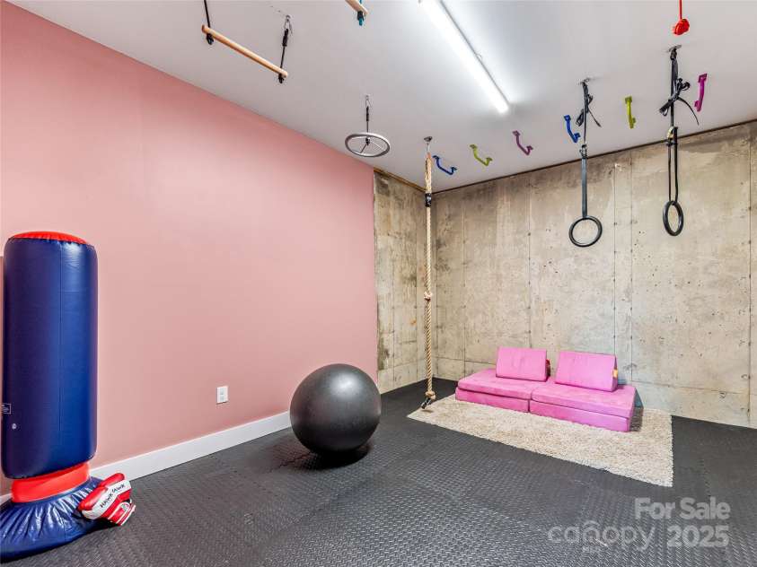 16 Pisgah Ridge Trail, Mills River, NC 28759.  MLS# CAR4257871, YatesRealty ID 18784. Bonus Room on Lower Level. Keep as an Entertainment Space or Convert to Bedroom.