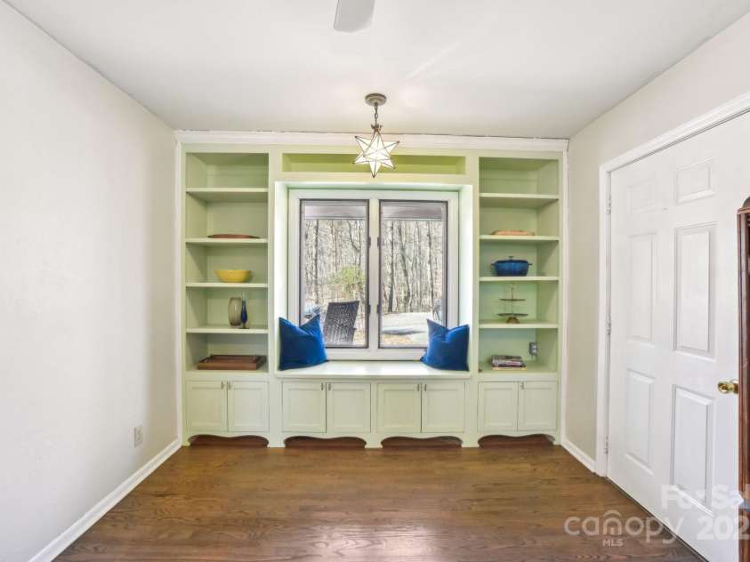 160 Lakota Lane, Tryon, NC 28782.  MLS# CAR4228822, YatesRealty ID 18789. Kitchen with built-ins and a window seat