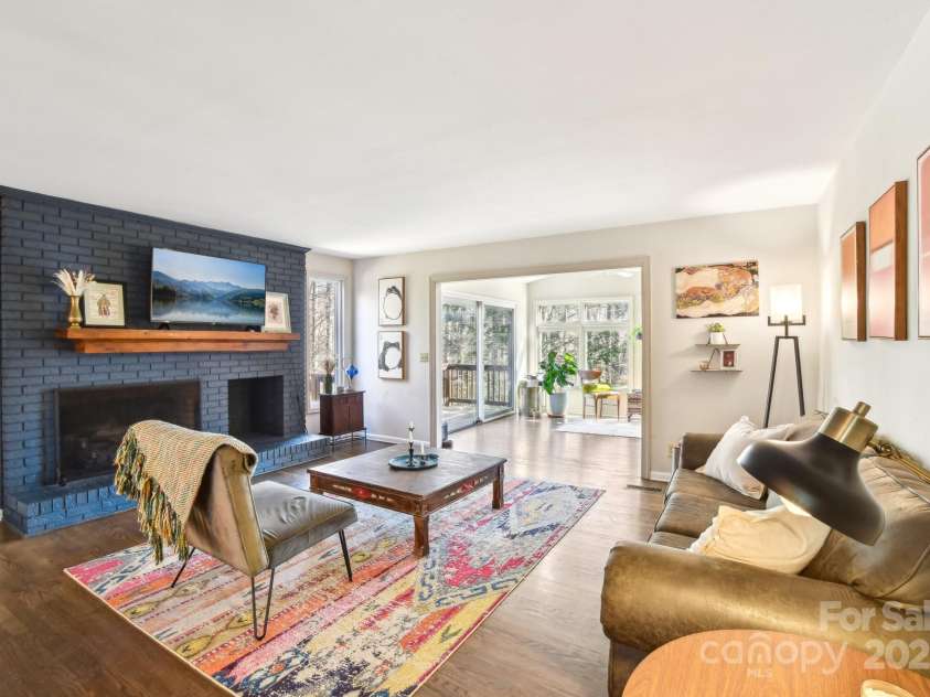 160 Lakota Lane, Tryon, NC 28782.  MLS# CAR4228822, YatesRealty ID 18789. Living area with propane fireplace
