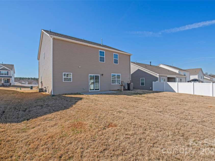 7324 Teague Drive, Gastonia, NC 28056.  MLS# CAR4217797, YatesRealty ID 18793. Backyard and Exterior of home