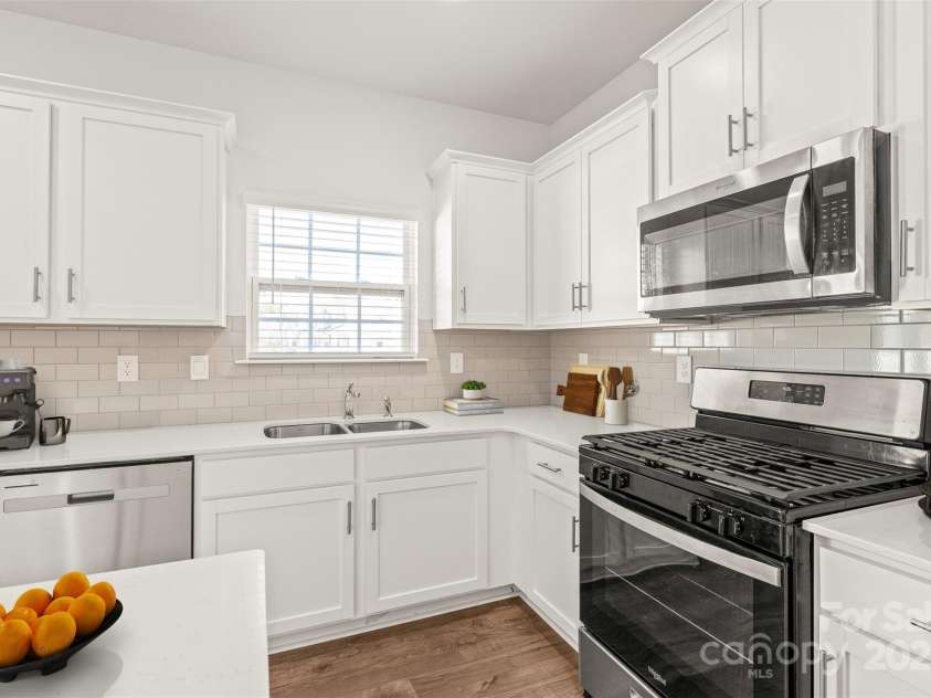 7324 Teague Drive, Gastonia, NC 28056.  MLS# CAR4217797, YatesRealty ID 18793. Spacious kitchen with island and stainless appliances including gas stove