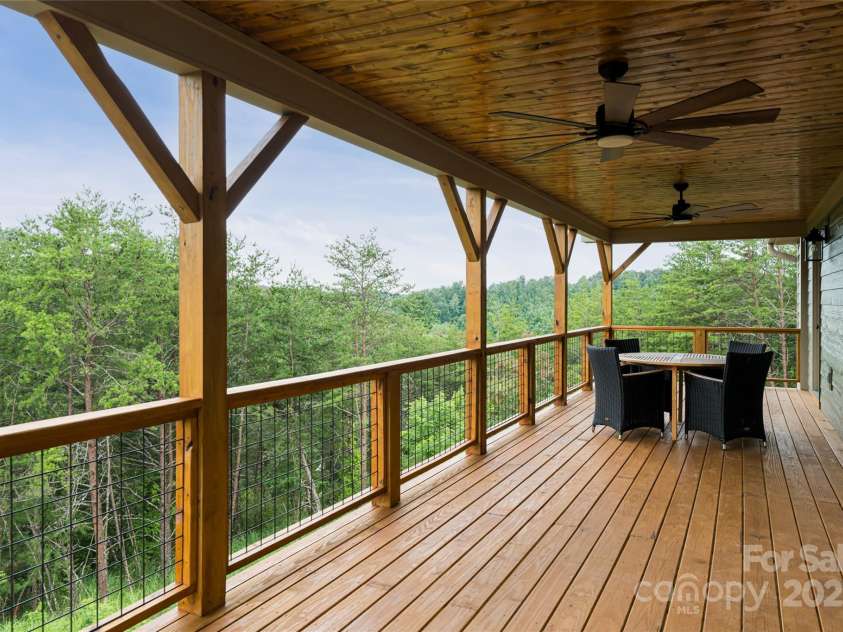 181 Flint Morgan Road, Mars Hill, NC 28754.  MLS# CAR4288459, YatesRealty ID 1880. Covered Back Deck