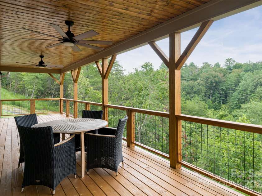 181 Flint Morgan Road, Mars Hill, NC 28754.  MLS# CAR4288459, YatesRealty ID 1880. Expansive covered back deck to take in the mountain views