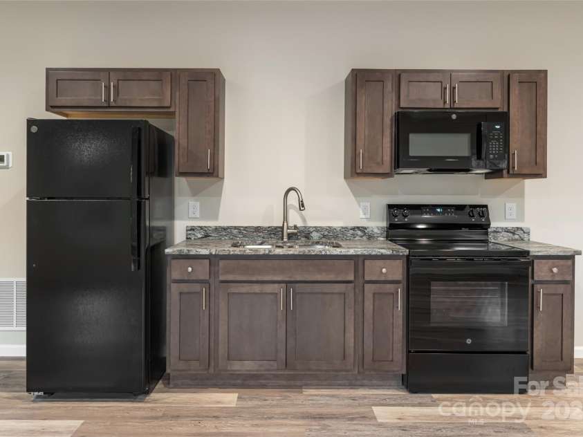 181 Flint Morgan Road, Mars Hill, NC 28754.  MLS# CAR4288459, YatesRealty ID 1880. Full Kitchenette in Basement Family Room