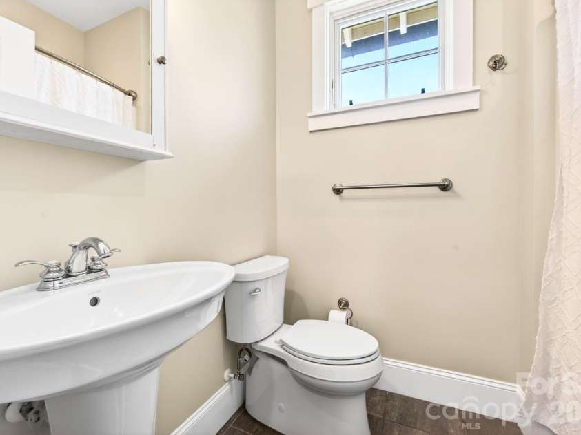 4 Fitzgerald Road, Black Mountain, NC 28711.  MLS# CAR4371041, YatesRealty ID 18801. Guest half bath on the main level just off the laundry area.