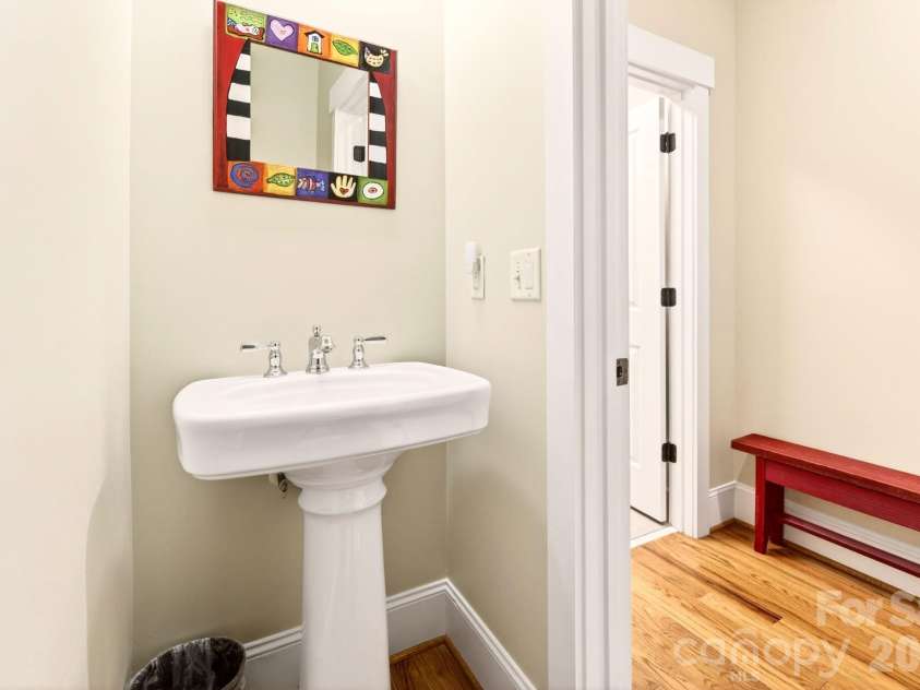 4 Fitzgerald Road, Black Mountain, NC 28711.  MLS# CAR4371041, YatesRealty ID 18801. Guest half bath on the main level just off the laundry area. 