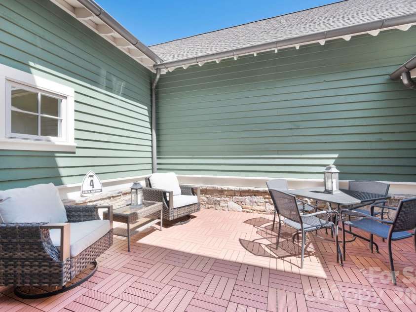 4 Fitzgerald Road, Black Mountain, NC 28711.  MLS# CAR4371041, YatesRealty ID 18801. Private courtyard off the main living area with new non-slip tiles on the ground. 