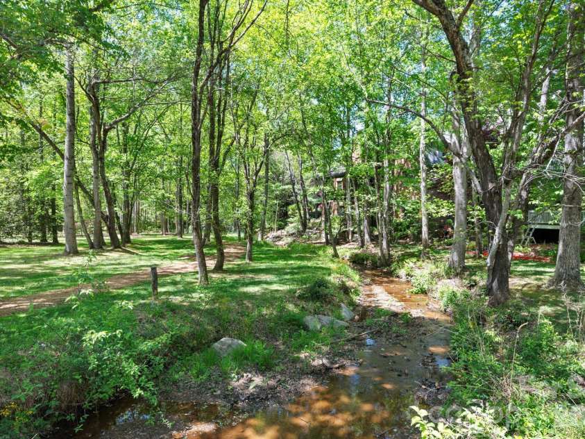 4 Fitzgerald Road, Black Mountain, NC 28711.  MLS# CAR4371041, YatesRealty ID 18801. Streams that meander throughout the community with walking paths. 