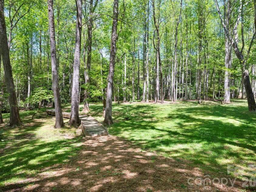 4 Fitzgerald Road, Black Mountain, NC 28711.  MLS# CAR4371041, YatesRealty ID 18801. Streams that meander throughout the community with walking paths.