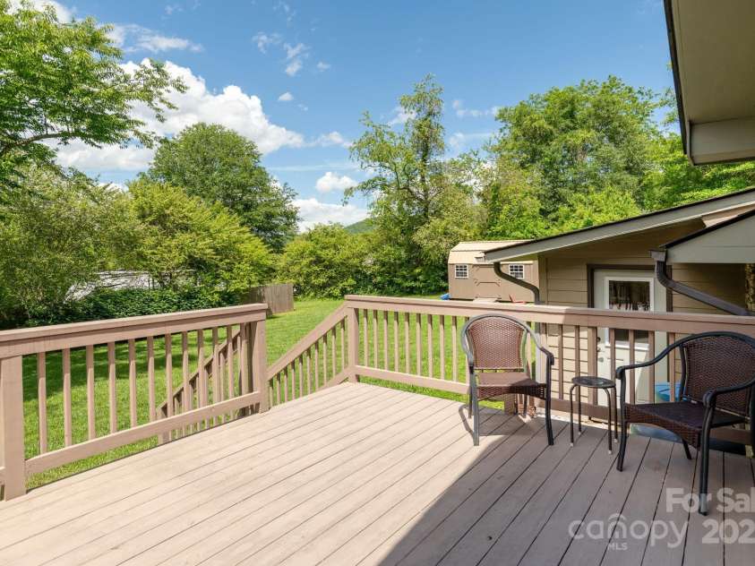4329 Island Ford Road, Brevard, NC 28712.  MLS# CAR4252076, YatesRealty ID 18801. Deck off Primary Bedroom leading to backyard