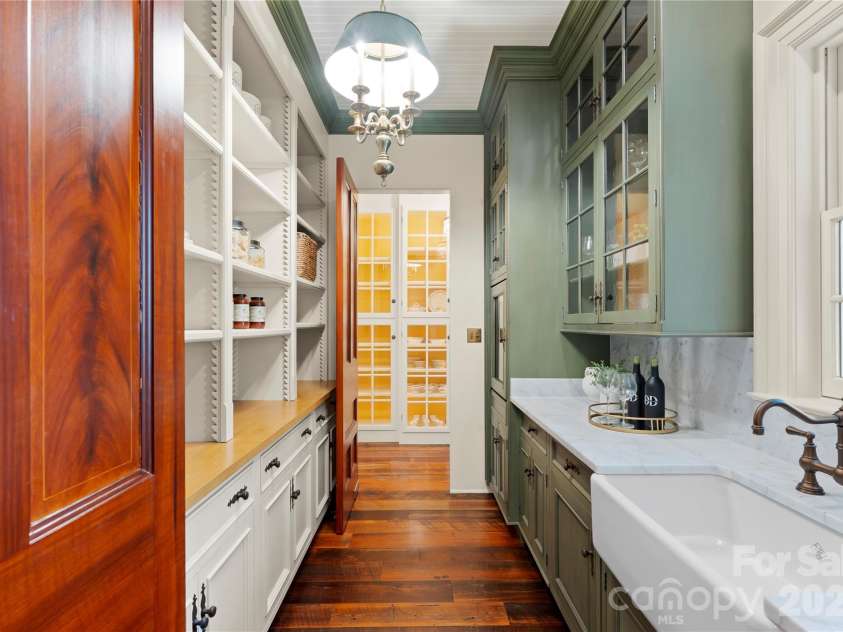 5520 Sharon View Road, Charlotte, NC 28226.  MLS# CAR4360655, YatesRealty ID 18805. Scullery with ample cabinetry, generous prep space, and natural light, designed for both everyday living and entertaining
