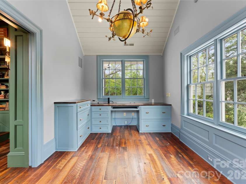 5520 Sharon View Road, Charlotte, NC 28226.  MLS# CAR4360655, YatesRealty ID 18805. Versatile flex space ideal for a home office, study, or additional living area, featuring large windows and abundant natural light.