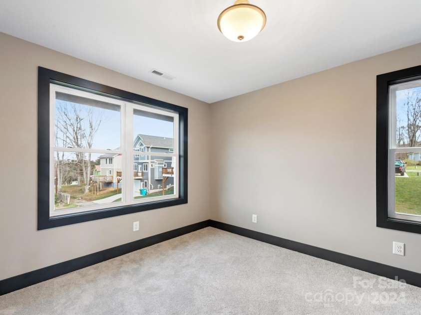 52 Fox Drive, Asheville, NC 28803.  MLS# CAR4201409, YatesRealty ID 1881. 2nd Bedroom with large windows 