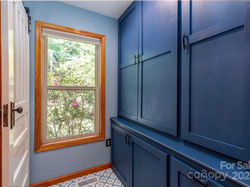 1645 Hickory Springs Road, Burnsville, NC 28714.  MLS# CAR4260205, YatesRealty ID 18810. Beautiful built in pantry off the kitchen