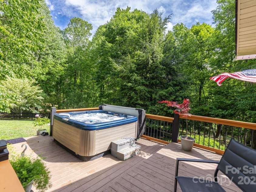 1645 Hickory Springs Road, Burnsville, NC 28714.  MLS# CAR4260205, YatesRealty ID 18810. Enjoy morning coffee or evening wine in the hot tub