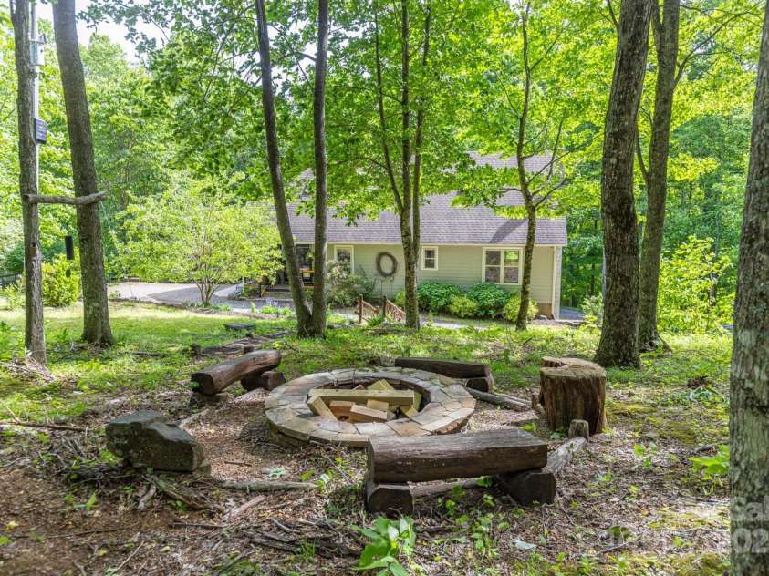 1645 Hickory Springs Road, Burnsville, NC 28714.  MLS# CAR4260205, YatesRealty ID 18810. Fire pit in the woods
