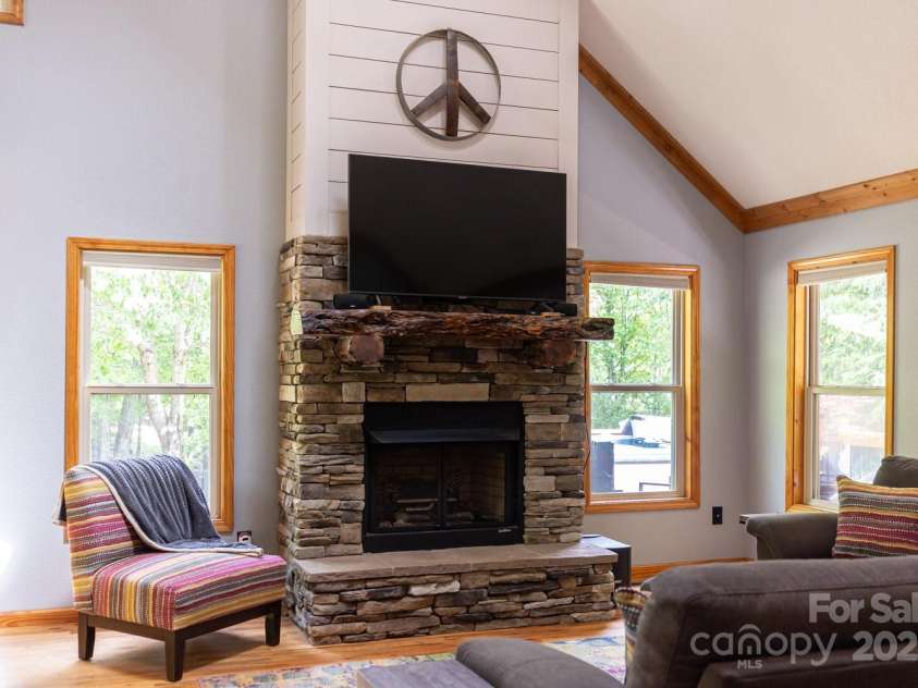 1645 Hickory Springs Road, Burnsville, NC 28714.  MLS# CAR4260205, YatesRealty ID 18810. Fireplace with local Yancey Co wood mantle