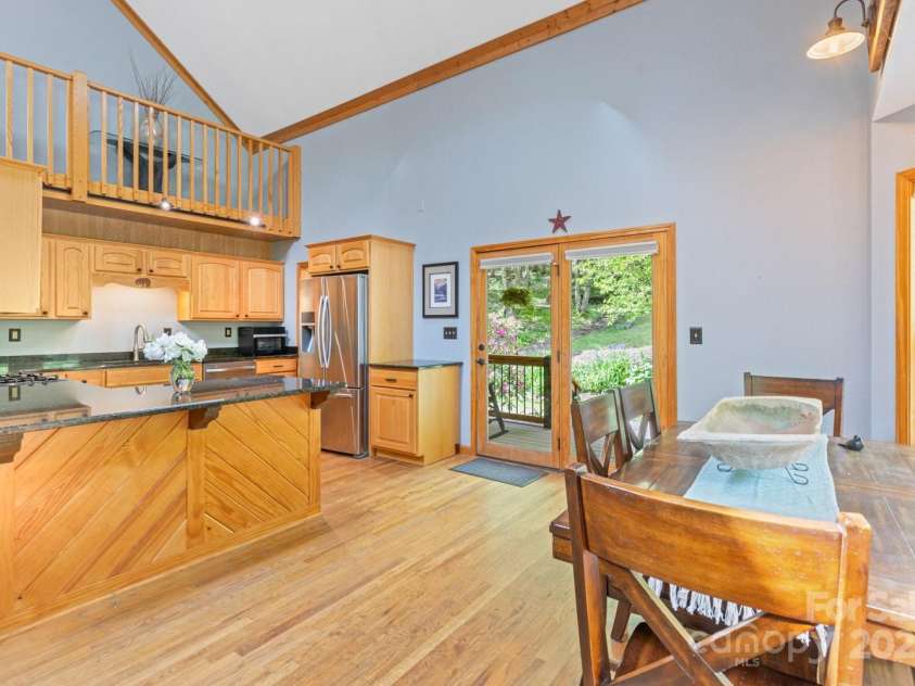 1645 Hickory Springs Road, Burnsville, NC 28714.  MLS# CAR4260205, YatesRealty ID 18810. Kitchens opens into dining area