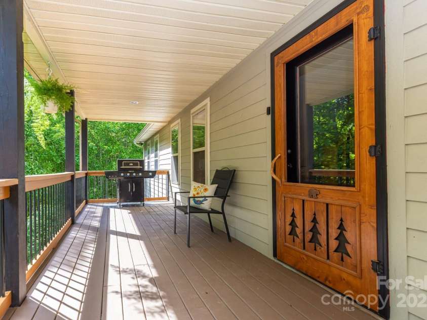 1645 Hickory Springs Road, Burnsville, NC 28714.  MLS# CAR4260205, YatesRealty ID 18810. Large front porch with beautifully made door