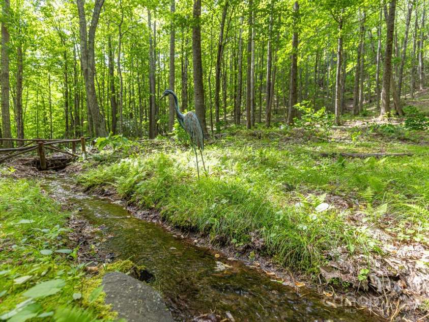 1645 Hickory Springs Road, Burnsville, NC 28714.  MLS# CAR4260205, YatesRealty ID 18810. Small stream in the yard