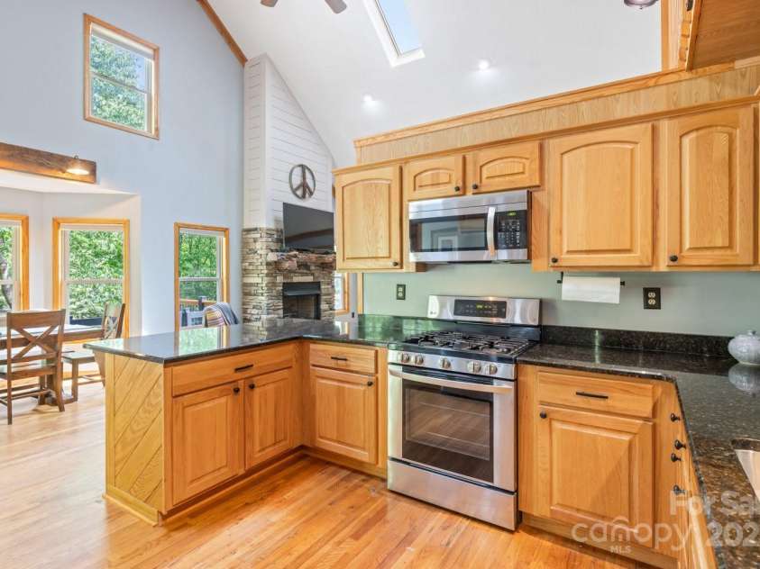 1645 Hickory Springs Road, Burnsville, NC 28714.  MLS# CAR4260205, YatesRealty ID 18810. View from kitchen where door is to pantry and laundry