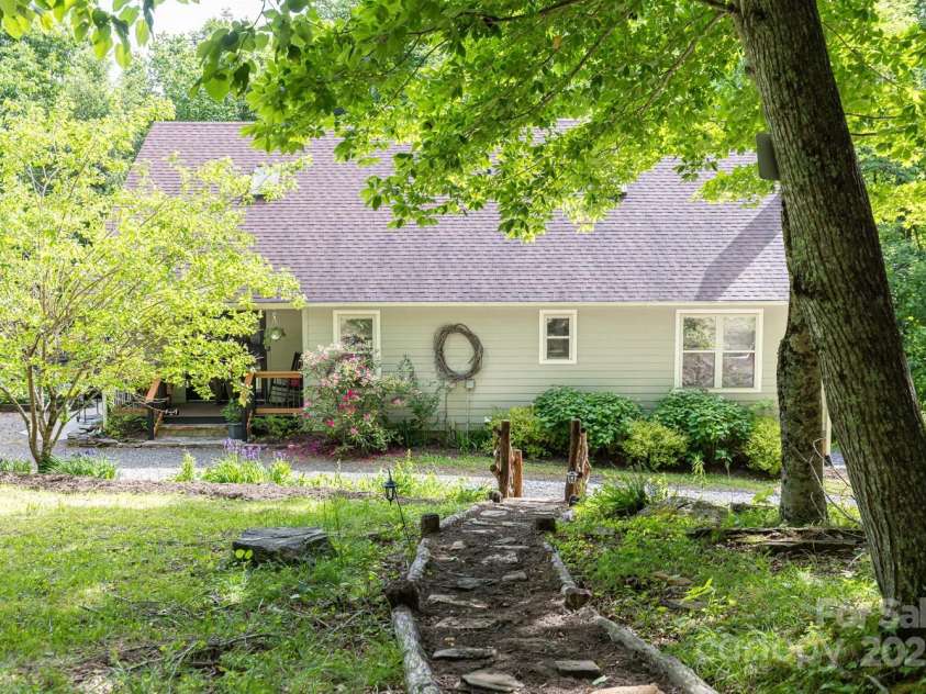 1645 Hickory Springs Road, Burnsville, NC 28714.  MLS# CAR4260205, YatesRealty ID 18810. Walk down the path from the fire pit back to the house