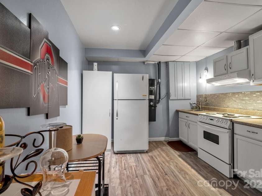 97 Ballantree Drive, Asheville, NC 28803.  MLS# CAR4231911, YatesRealty ID 18818. A complete second kitchen downstairs