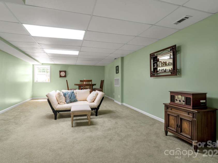 97 Ballantree Drive, Asheville, NC 28803.  MLS# CAR4231911, YatesRealty ID 18818. A spacious flex area perfect for recreation, hobbies, or additional living space.