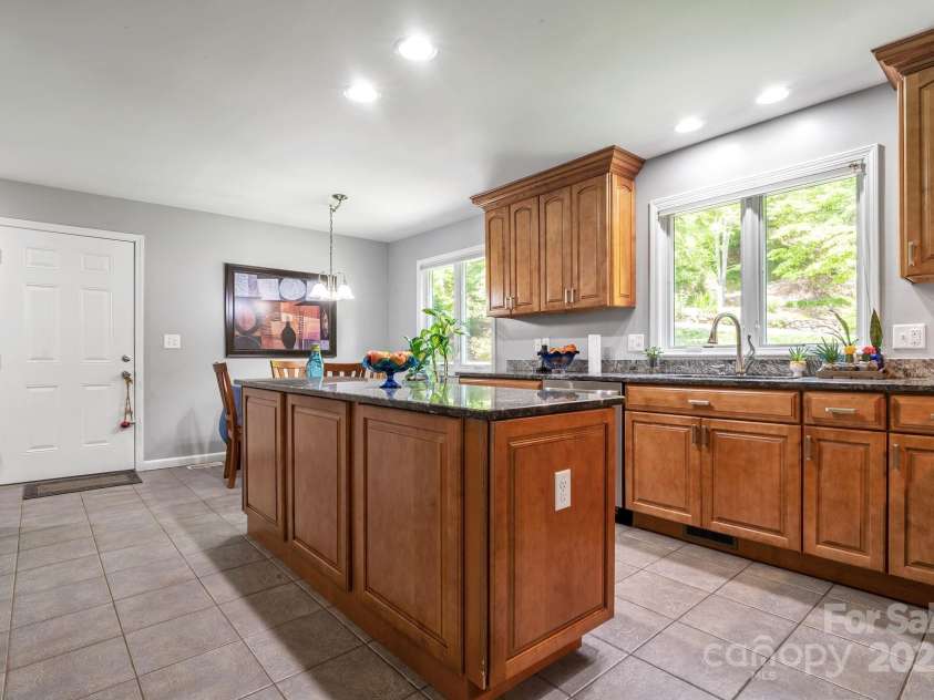 97 Ballantree Drive, Asheville, NC 28803.  MLS# CAR4231911, YatesRealty ID 18818. Beautifully designed kitchen with abundant cabinetry, granite countertops