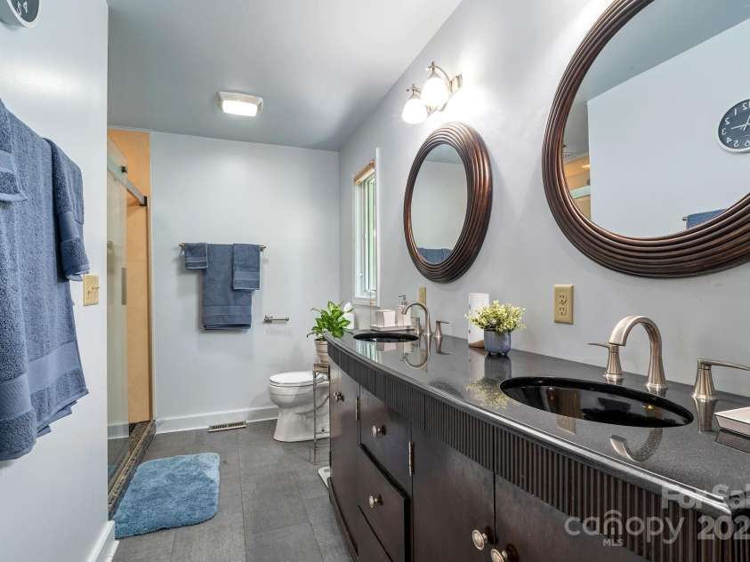 97 Ballantree Drive, Asheville, NC 28803.  MLS# CAR4231911, YatesRealty ID 18818. Beautifully updated bathroom with double vanities