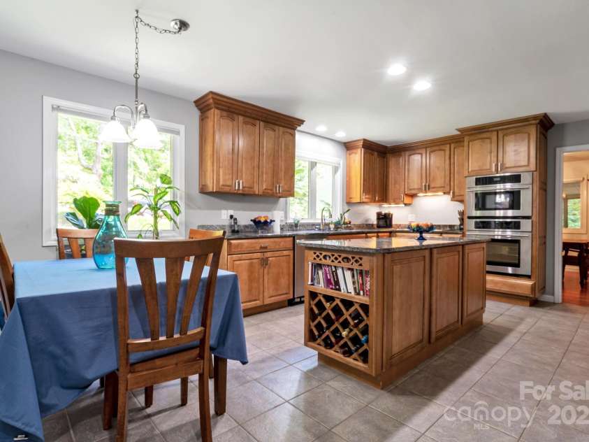97 Ballantree Drive, Asheville, NC 28803.  MLS# CAR4231911, YatesRealty ID 18818. Bright and open kitchen with modern finishes, stainless steel appliances, and plenty of counter space.