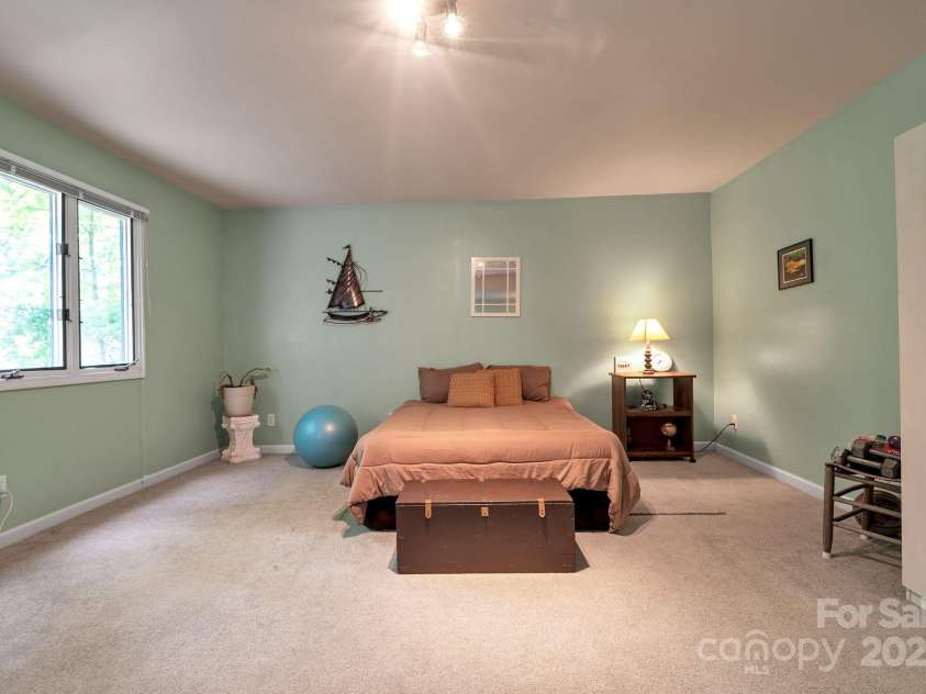 97 Ballantree Drive, Asheville, NC 28803.  MLS# CAR4231911, YatesRealty ID 18818. Comfortable and quiet retreat downstairs — perfect for long-term guests or family members.