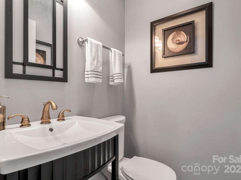 97 Ballantree Drive, Asheville, NC 28803.  MLS# CAR4231911, YatesRealty ID 18818. Half- Bathroom near kitchen walk in pantry