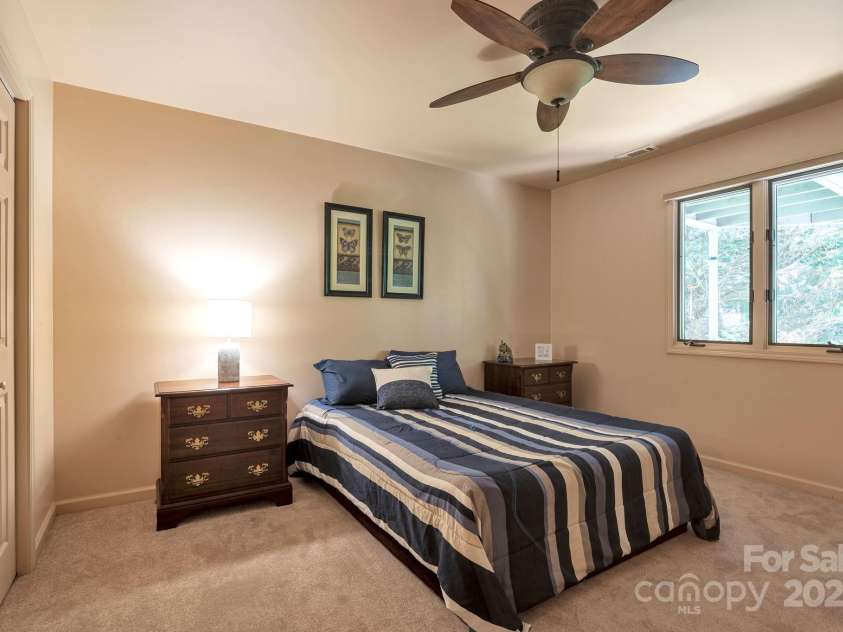 97 Ballantree Drive, Asheville, NC 28803.  MLS# CAR4231911, YatesRealty ID 18818. Private lower-level bedroom with easy access to the second living area and full bath.