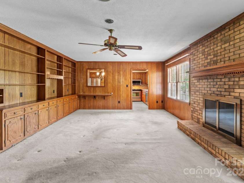 885 Roy Cline Road, Rockwell, NC 28138.  MLS# CAR4268618, YatesRealty ID 18819. Family room with fireplace and built-ins