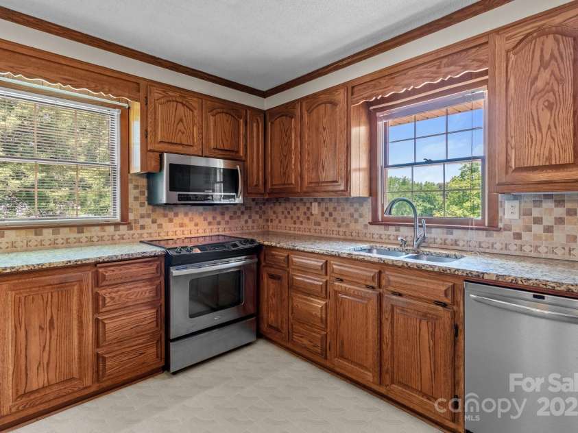 885 Roy Cline Road, Rockwell, NC 28138.  MLS# CAR4268618, YatesRealty ID 18819. Main floor kitchen with beautiful wood cabinetry