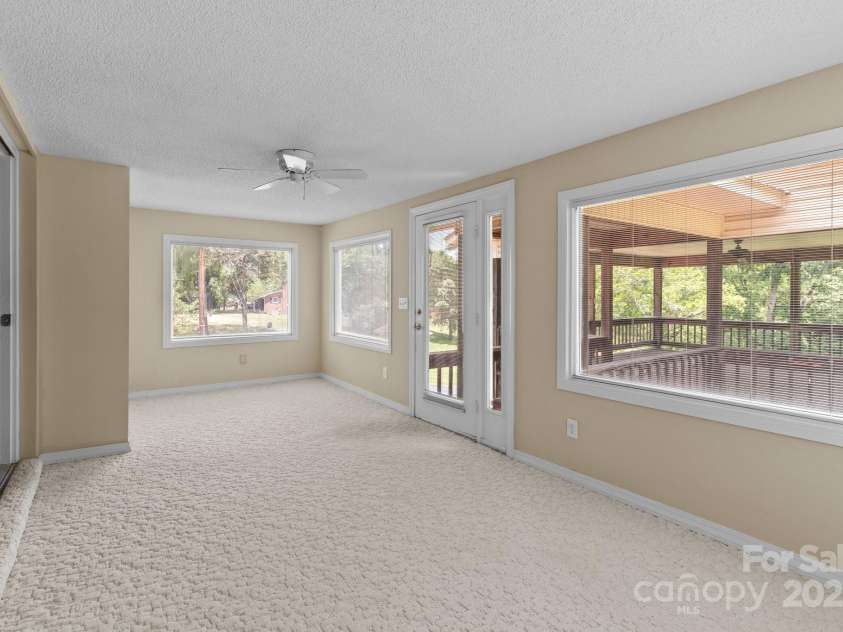 885 Roy Cline Road, Rockwell, NC 28138.  MLS# CAR4268618, YatesRealty ID 18819. Sunroom leads to covered deck