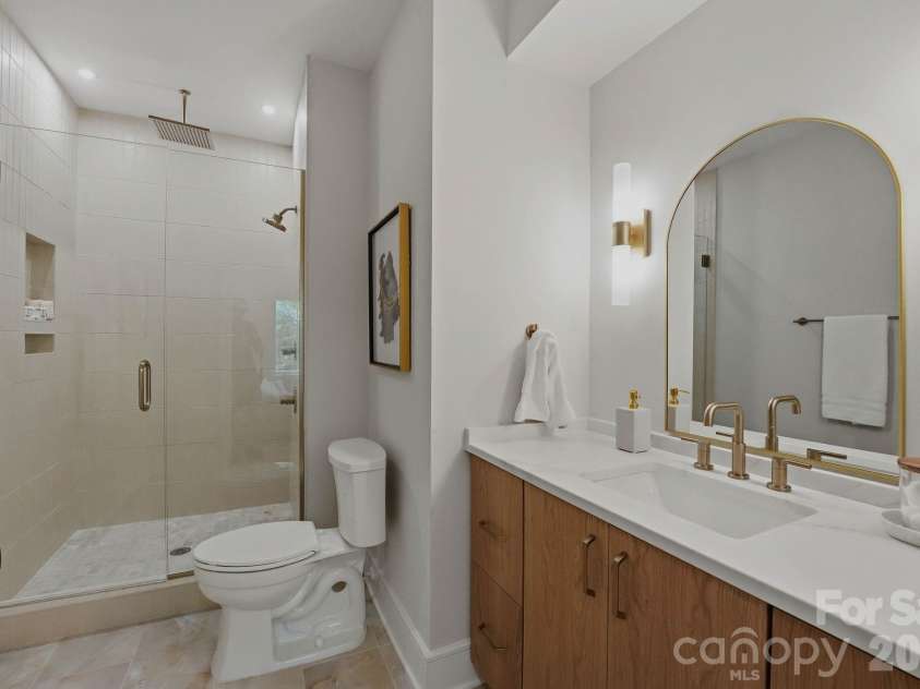 610 16th Street, Charlotte, NC 28206.  MLS# CAR4328794, YatesRealty ID 1883. Primary bathroom as staged model example only.