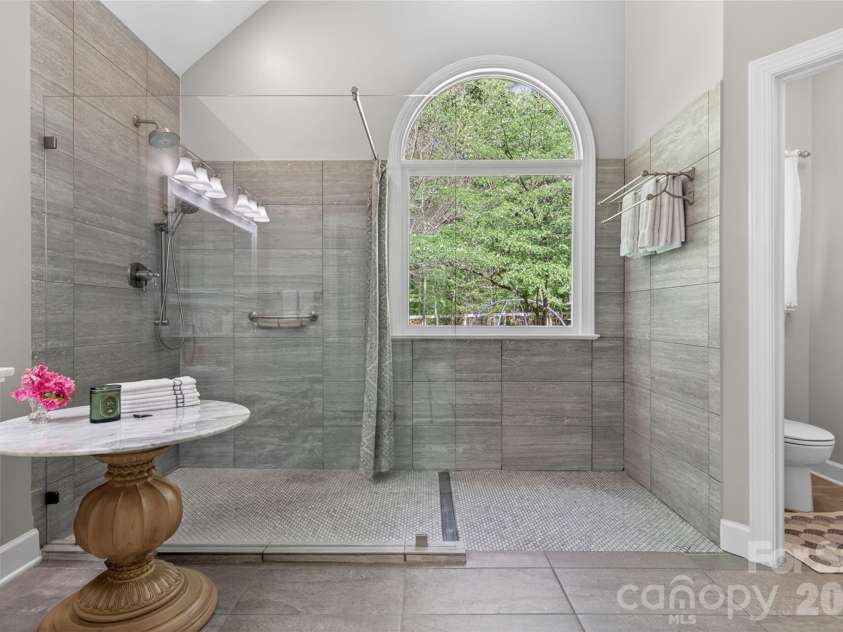 3336 Colvard Park Way, Charlotte, NC 28269.  MLS# CAR4368461, YatesRealty ID 18831. Glass Enclosed Open Feature Shower