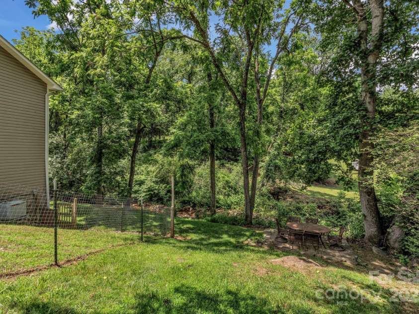 222 New Stock Road, Weaverville, NC 28787.  MLS# CAR4266697, YatesRealty ID 18833. Side yard