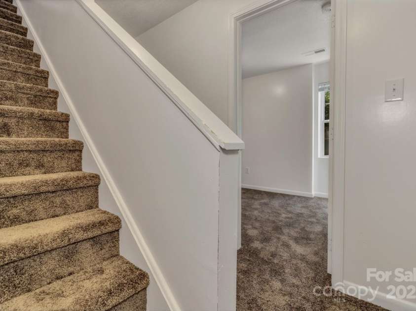 222 New Stock Road, Weaverville, NC 28787.  MLS# CAR4266697, YatesRealty ID 18833. Unit A - stairs to bedrooms