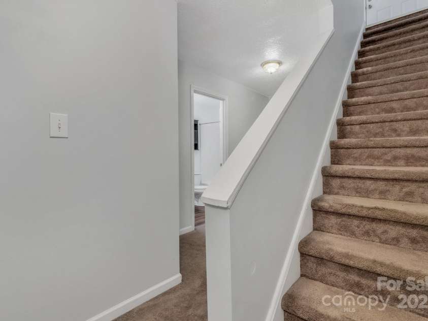 222 New Stock Road, Weaverville, NC 28787.  MLS# CAR4266697, YatesRealty ID 18833. Unit B Stairs to bedroom