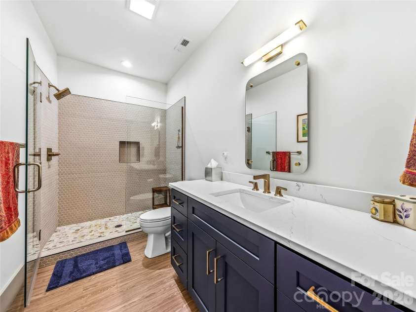 80 Caledonia Road, Asheville, NC 28803.  MLS# CAR4357837, YatesRealty ID 18834. Hall bath - lower level