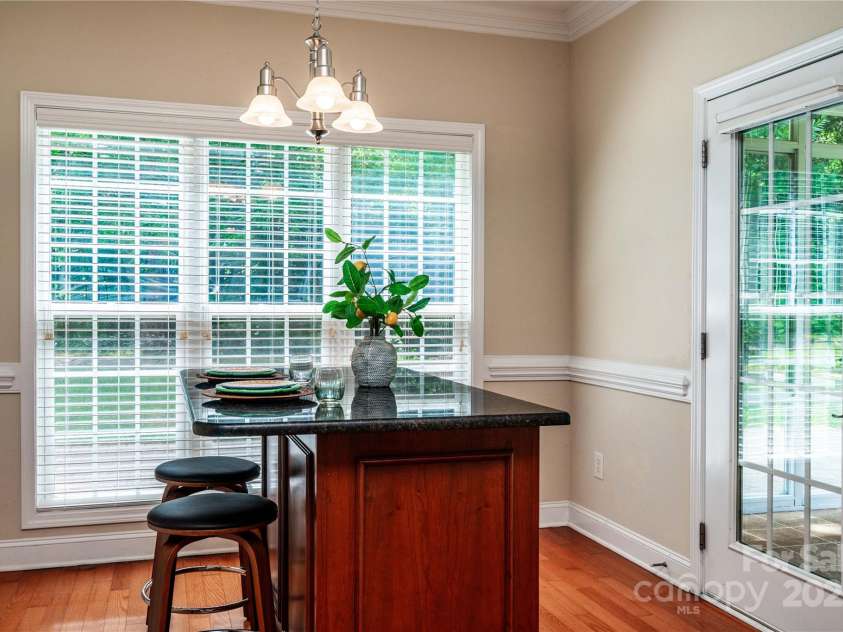 141 Aberdeen Drive, Troutman, NC 28166.  MLS# CAR4269630, YatesRealty ID 18836. Bright sunny breakfast area leads to all-season room