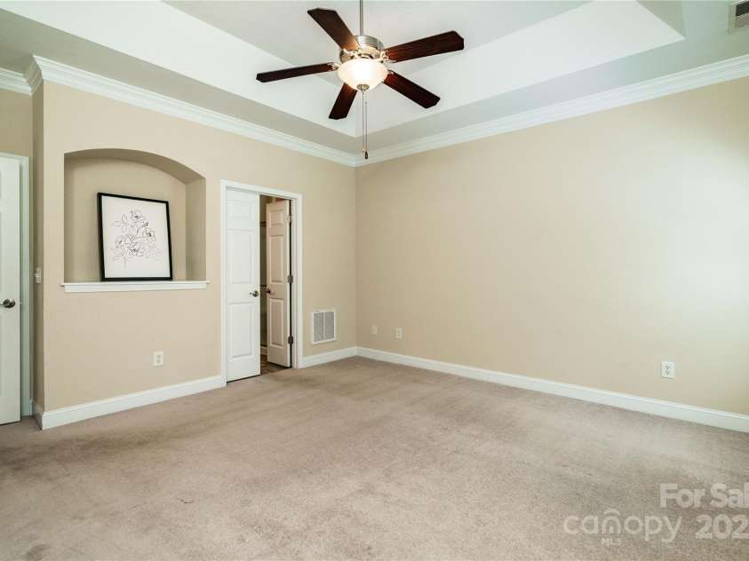 141 Aberdeen Drive, Troutman, NC 28166.  MLS# CAR4269630, YatesRealty ID 18836. Ceiling fan and beautiful moldings