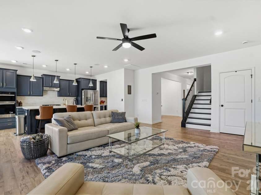 40184 Crooked Stick Drive, Lancaster, SC 29720.  MLS# CAR4356977, YatesRealty ID 18836. Great room with kitchen in the background